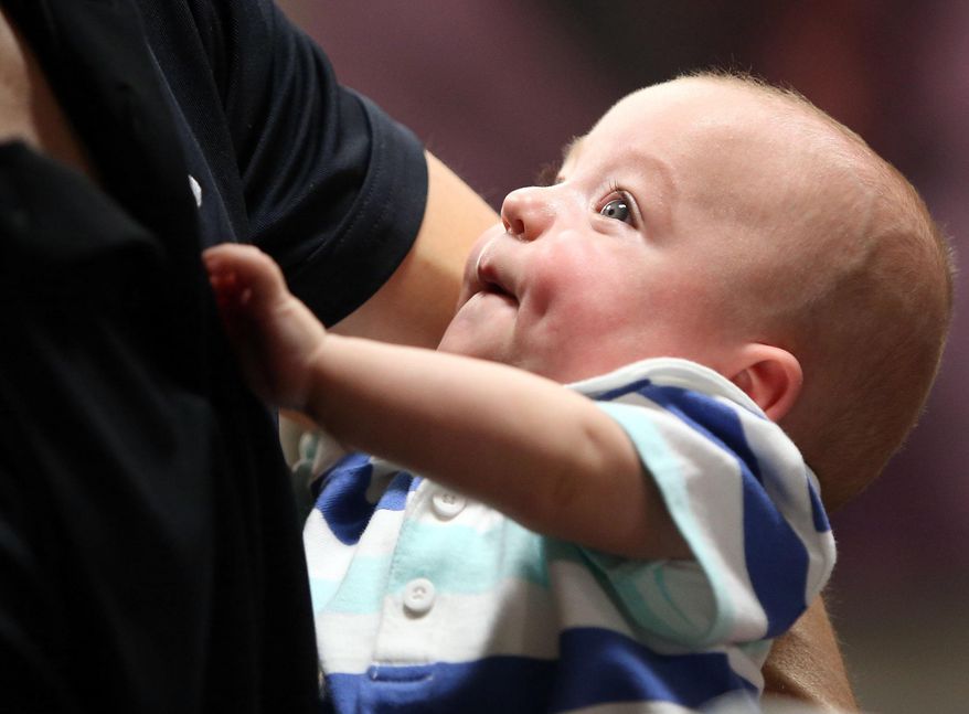 Chase Morgan holds his son Haiden Morgan at the University of Utah Hospital in Salt Lake City on Friday, April 1, 2016. Haiden Morgan was born three months premature on a cruise in the Caribbean in November. AirMed flew him home from Miami. (Kristin Murphy/The Deseret News via AP)