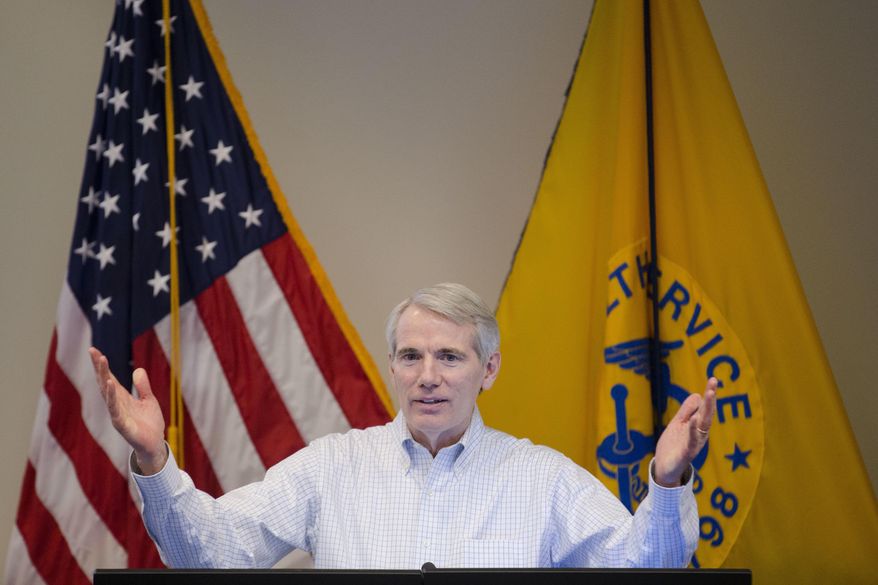 U.S. Sen. Rob Portman, R-Ohio, discusses efforts to increase health and safety for workers at the National Institute for Occupation Safety and Health (NIOSH) facility, Friday, April 1, 2016, in Cincinnati. Portman is facing a re-election battle this year against Democratic former Gov. Ted Strickland. It's a race being watched nationally as Democrats try to win back control of the Senate. (AP Photo/John Minchillo)