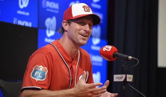 Washington Nationals pitcher Max Scherzer speaks at a press conference before an exhibition baseball game against the Minnesota Twins, Friday, April 1, 2016, in Washington. (AP Photo/Nick Wass)