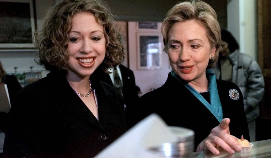 ADVANCE FOR SUNDAY, APRIL 3, 2016 AND THEREAFTER - FILE - In this Oct. 30, 2000 file photo, Senate candidate then first lady Hillary Clinton, right, and daughter, Chelsea, look over marzipan pastries at the Florentine Pastry Shop in Utica, N.Y. as they started their third day of a three-day trip in upstate New York.  (AP Photo/ Jim McKnight, File)