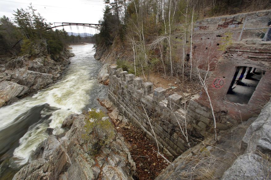 In this Tuesday March 29, 2016 photo, the remains of an early 19th century mill is seen on the banks of Livermore Falls in Campton, N.H. This summer New Hampshire's archaeology field school program run by the Division of Historical Resources is focusing on the areas mill community that thrived in the 1800s. (AP Photo/Jim Cole)