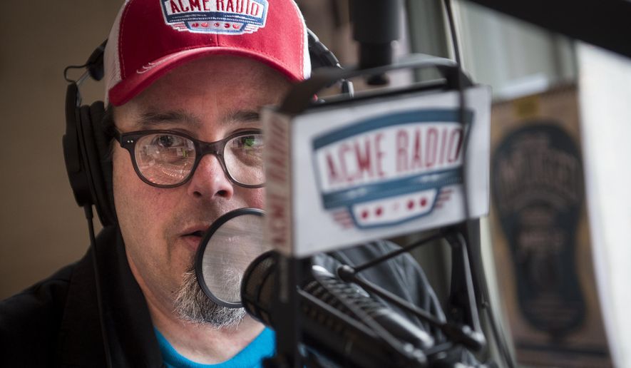 Tim Hibbs, DJ of The Vinyl Lunch, speaks while broadcasting his show at Acme Radio, Thursday, March 24, 2016, in Nashville, Tenn. In the two years since it opened inside the historic building at the corner of First Avenue and Broadway, Acme has carefully cultivated a reputation as the alternative honky-tonk, with an upscale food service and music programming, unlike its well-established neighbors. (Andrew Nelles/The Tennessean via AP) NO SALES; MANDATORY CREDIT