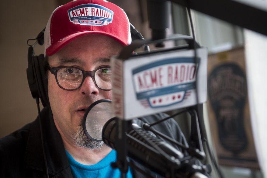 Tim Hibbs, DJ of The Vinyl Lunch, speaks while broadcasting his show at Acme Radio, Thursday, March 24, 2016, in Nashville, Tenn. In the two years since it opened inside the historic building at the corner of First Avenue and Broadway, Acme has carefully cultivated a reputation as the alternative honky-tonk, with an upscale food service and music programming, unlike its well-established neighbors. (Andrew Nelles/The Tennessean via AP) NO SALES; MANDATORY CREDIT