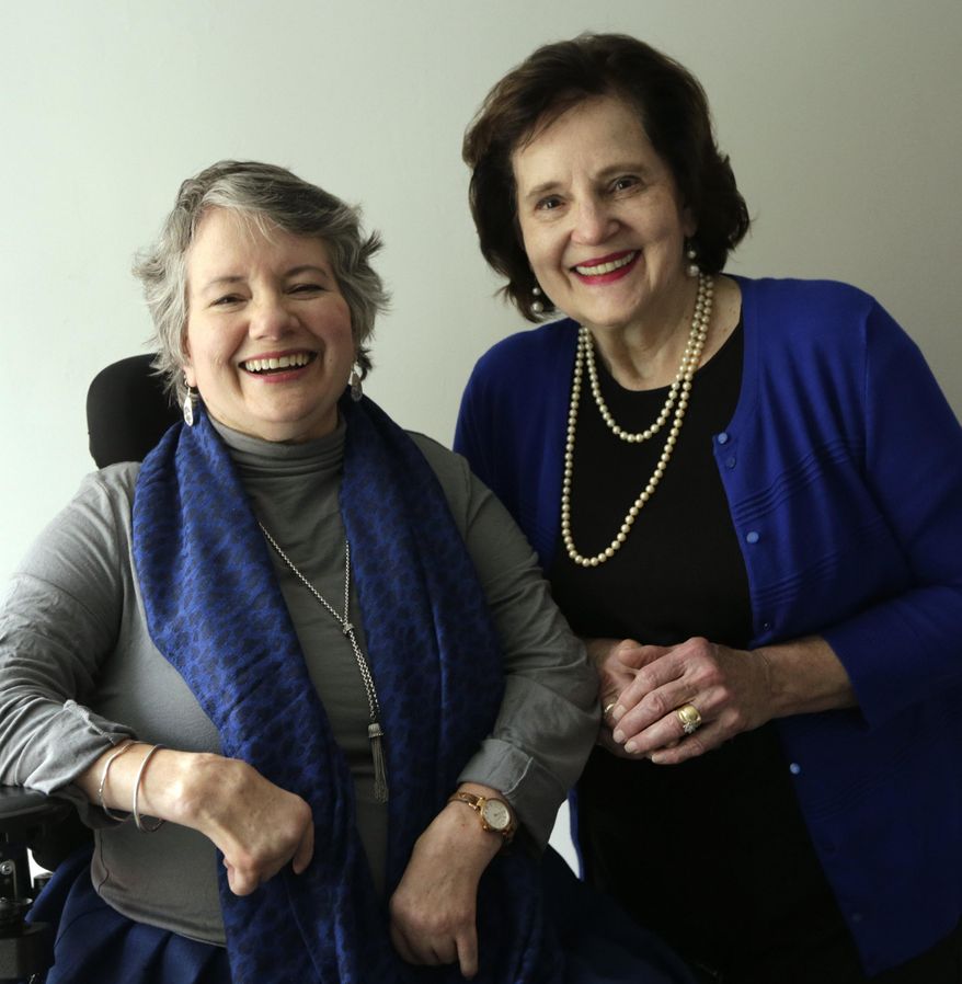 In this March 14, 2016, photo, Amy Dougherty and her mother Shirley Dougherty pose for a photo at Bluegrass Elderlaw in Lexington, Ky. Amy Dougherty has arthrogryposis multiplex congenita, a condition that causes some joints to be stiff and crooked at birth. People with AMC lack normal range of motion in one or more joints. (Pablo Alcala/Lexington Herald-Leader via AP) MANDATORY CREDIT