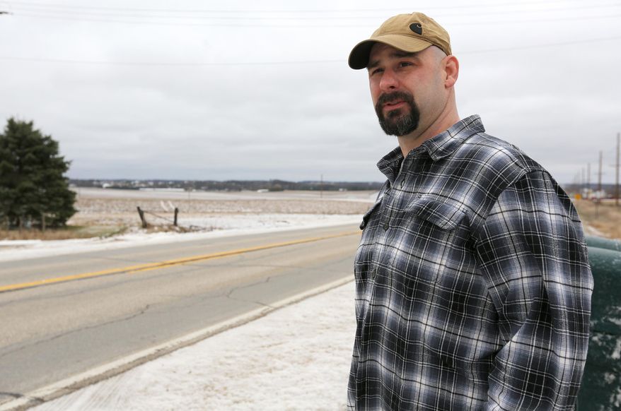 ADVANCE FOR RELEASE SATURDAY, APRIL 2, 2016, AT 12:01 A.M. CDT. AND THEREAFTER - In this photo from March 24, 2016, rural Dyersville, Iowa, resident Kory Manternach poses for a photo in Dyersville. Some rural Dyersville residents are fighting to stop a fertilizer facility from being built near their homes. Manternach, whose home sits about a quarter-mile from where two anhydrous ammonia tanks would be installed, said he's willing to do whatever it takes to prevent the fertilizer facility from taking shape. (Dave Kettering/Telegraph Herald via AP) MANDATORY CREDIT