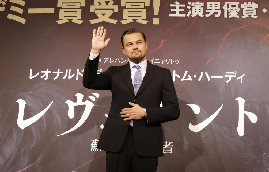 FILE - In this Wednesday, March 23, 2016, Actor Leonardo DiCaprio waves during a photo session of the movie “The Revenant” in Tokyo. An Indonesian immigration official says Hollywood actor Leonardo DiCaprio may be banned from returning to Indonesia over his criticisms that palm oil plantations are destroying the country's rainforests. (AP Photo/Eugene Hoshiko, File)