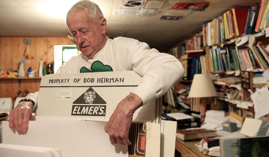 ADVANCE FOR WEEKEND EDITIONS - In this March 24, 2016 photo, Bob Heirman goes through records and data materials in his study in Snohomish, Wash. Heirman, a longtime fisherman, outdoorsman and environmentalist, has a lifetime of records of fish runs and conditions that makes him a repository of historical knowledge. (Kevin Clark/The Herald via AP) MANDATORY CREDIT