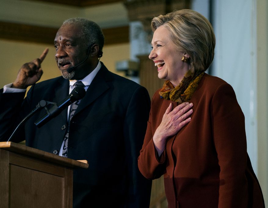 The Rev. Dr. Johnny Ray Youngblood speaks to congregants as he introduces Democratic presidential candidate Hillary Clinton at the Mount Pisgah Baptist Church in the Brooklyn borough of New York, Sunday, April 3, 2016. (AP Photo/Craig Ruttle)