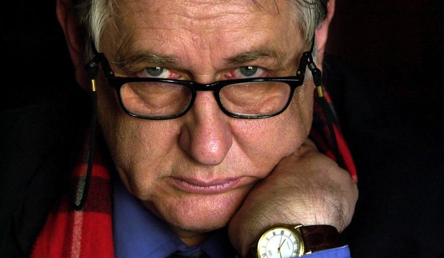 In this photo from Sept. 29, 2002, Bob Ellis attends the launch his new book "Goodbye Babylon" in Sydney, Australia. Ellis, an Australian author, journalist and speech writer for the center-left Labor Party died at his Sydney home of liver cancer on Sunday, April 3, 2016, his son said. He was 73 years old. (Mick Tsikas/AAP Image via AP) NO ARCHIVING, AUSTRALIA OUT, NEW ZEALAND OUT, PAPUA NEW GUINEA OUT, SOUTH PACIFIC OUT