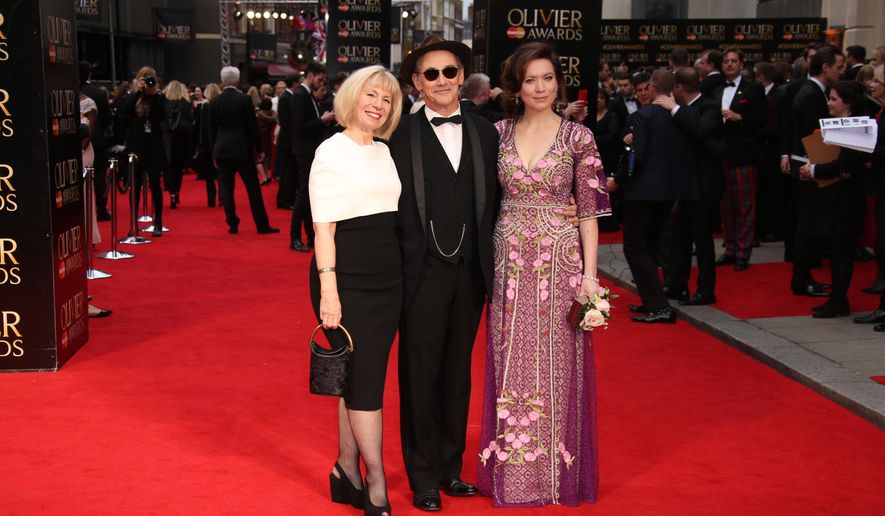 Claire van Kampen, from left, actor Mark Rylance and Juliet Rylance pose for photographers upon arrival at the Olivier Awards in London, Sunday, April 3, 2016. (Photo by Joel Ryan/Invision/AP)