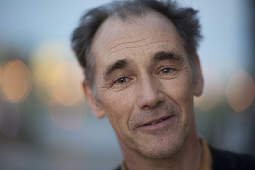 FILE - In this Monday, Feb. 23, 2015 file photo, British actor Mark Rylance, who was the first Artistic Director of Shakespeare's Globe theatre, poses for a portrait at Shakespeare's Globe theatre in London. Academy Award-winner Mark Rylance is a best-actor favorite at London's Olivier Awards on Sunday, April 3, 2016, a celebration of the London stage whose nominees include Benedict Cumberbatch, Judi Dench and Nicole Kidman. Rylance, who won a supporting-actor Oscar this year for "Bridge of Spies," is best-actor nominated for playing an 18th-century Spanish monarch in "Farinelli and the King." (AP Photo/Matt Dunham, file)