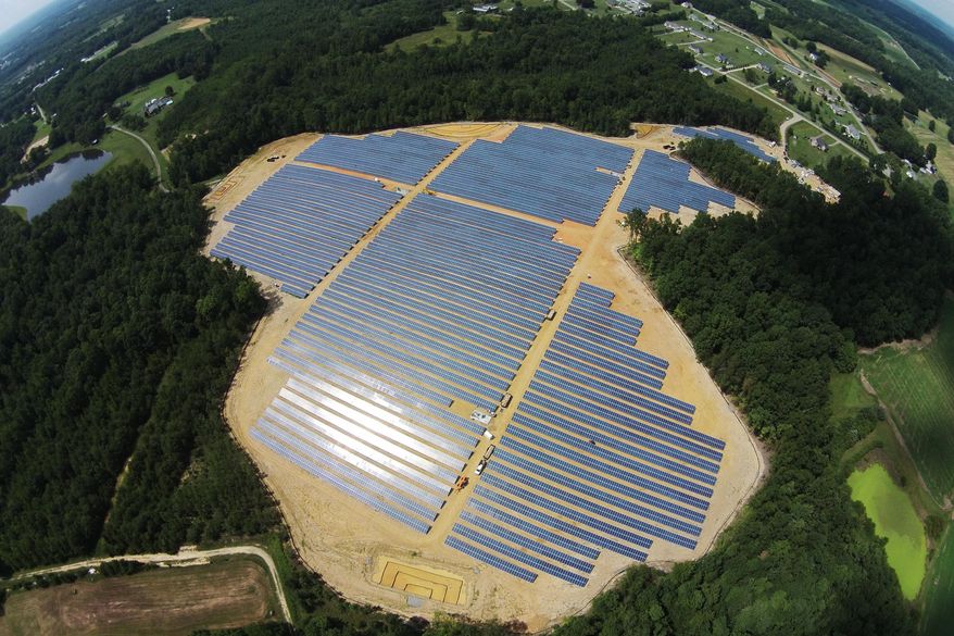 This Sept. 30, 2015 aerial photo provided by Cypress Creek Renewables, shows a commercial solar farm built on farmland by Cypress Creek Renewables in Catawba County, N.C. Less than a year after New York banned fracking, dashing the hopes of farmers who had hoped to reap royalties from natural gas leases, the commercial solar industry is courting landowners for energy production. Gov. Andrew Cuomo administration's initiatives aimed at promoting local renewable energy generation, reducing greenhouse gas emissions and generating 50 percent of the state's energy from renewable sources by 2030 are bringing solar developers to the state like Cypress Creek Renewable. (Cypress Creek Renewables via AP)
