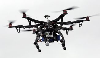 A commercial drone. (AP Photo/Rick Bowmer) ** FILE **