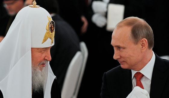 Russian President Vladimir Putin (right) and Russian Orthodox Church Patriarch Kirill remain cozy as Russians are jailed for pro-atheist statements, and anti-church sentiments slowly rise. (Associated Press)