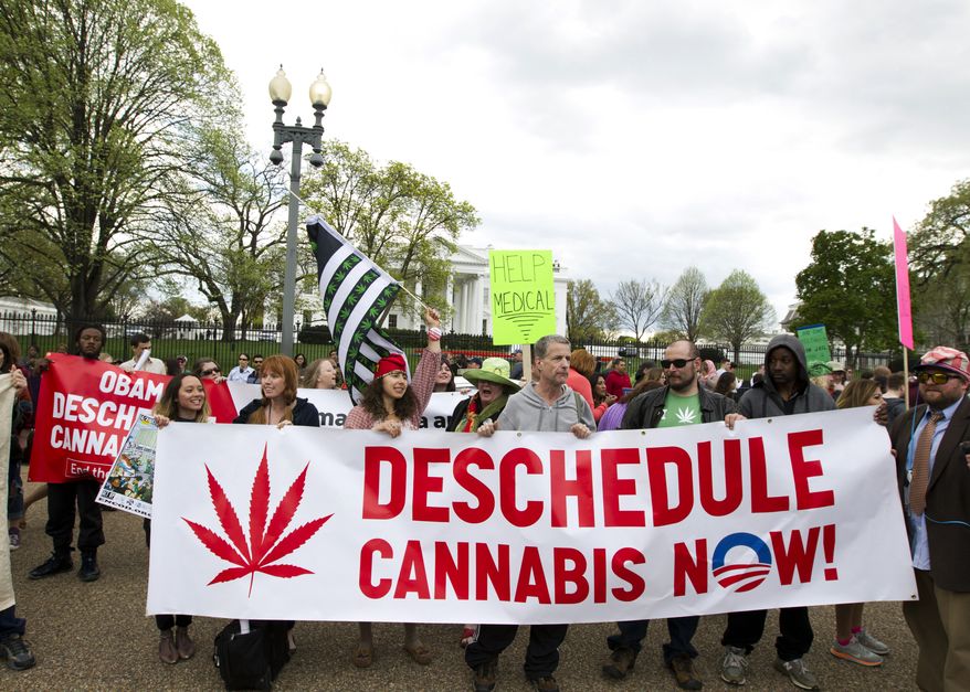 Demonstrators calling for the legalization of marijuana outside of the White House, in Washington, Saturday, April 2, 2016. They are demanding Obama use his authority to stop marijuana arrests and pardon offenders. (AP Photo/Jose Luis Magana) ** FILE **