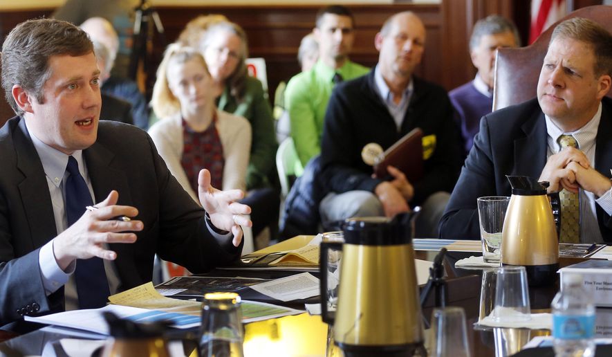 In this March 30, 2016 photo, gubernatorial hopefuls Colin Van Ostern, left, a Democrat and Chris Sununu a Republican, talk at the Governor and Council information hearing about the Mount Sunapee expansion plan in Concord, N.H. A yearslong effort to expand a ski mountain will finally get an up-or-down vote and, with it, force two gubernatorial candidates to pick sides in an emotional and unique New Hampshire issue. The Executive Council is set to vote Wednesday, April 6, 2016, on whether to approve the expansion, which includes more lifts and trails, at Mount Sunapee Resort. (AP Photo/Jim Cole)