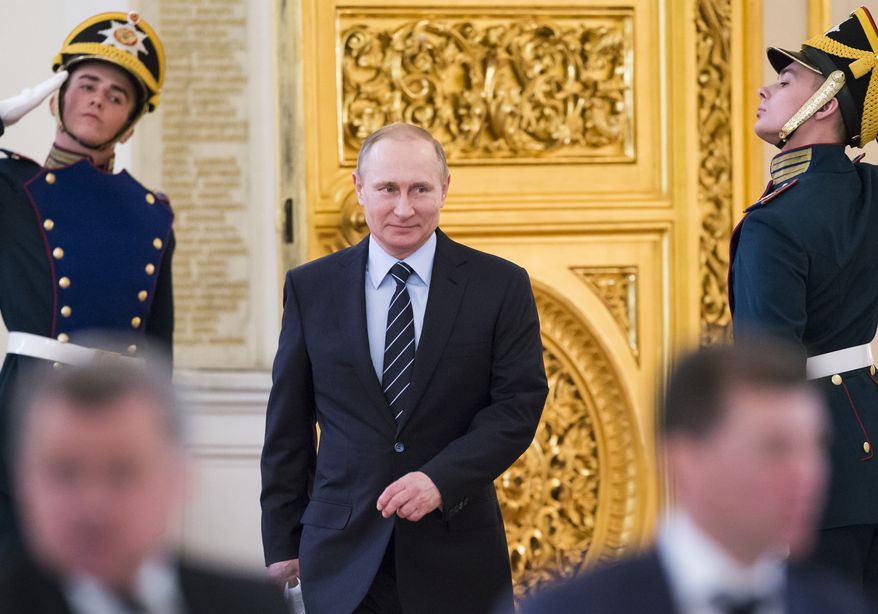 Russian President Vladimir Putin, center, arrives to hold a meeting of a committee on preparations for upcoming Victory Day in WWII, in Moscow's Kremlin, Russia, on Tuesday, April 5, 2016. Russia celebrates Victory Day on May 9. (AP Photo/Alexander Zemlianichenko, pool)