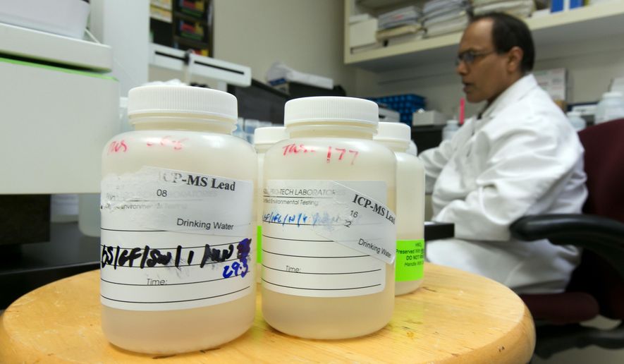 ADVANCE FOR SATURDAY, APRIL 9 AND THEREAFTER - In this Friday, March 25, 2016 photo, Director of Chemistry Ravi Swamy, of Aqua Pro-Tech Laboratories, uses inductively coupled plasma mass spectroscopy to test drinking water samples at the facility, in Fairfield, N.J. Responding to the crisis in Flint, Michigan, school officials across the country are testing for lead in the water flowing from classroom sinks and cafeteria faucets to reassure anxious parents or take action if they are surprised by the results. In March, the school district in Newark, New Jersey, shut off sinks and fountains in 30 buildings in response to high lead samples while offering to test as many as 17,000 children for lead contamination. (AP Photo/Richard Drew)