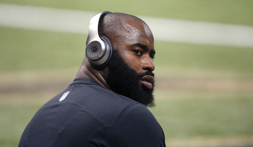 New Orleans Saints outside linebacker Junior Galette warms up before an NFL football game against the San Francisco 49ers in New Orleans, Sunday, Nov. 9, 2014. (AP Photo/Bill Haber)