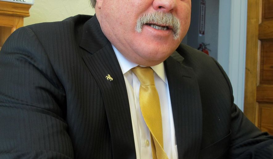 Wyoming state Sen. Tony Ross, R-Cheyenne, addresses reporters at his law office, Wednesday, April 6, 2016. He's the latest in a string of senior lawmakers to announce they won't seek re-election to the Wyoming Legislature. (AP Photo/Ben Neary)