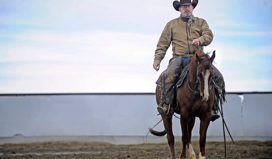 In this photo taken March 10, 2016, Vince Bellon trains a cutting horse at Riverbend Ranch in Idaho Falls, Idaho. He has to warm the horse up with start-stop drills, not unlike an athlete preparing for a football game. “This is my agenda, not his. He may still want to be sitting in a stall eating hay, or swishing flies,” Bellon said. (Pat Sutphin(/The Idaho Post-Register via AP) MANDATORY CREDIT