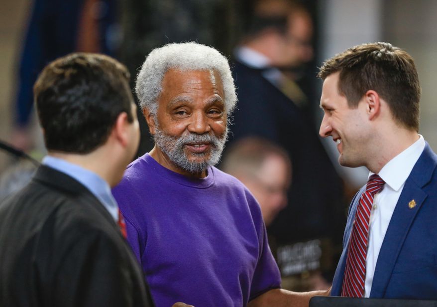 FILE - In this Feb. 18, 2016 file photo, Nebraska State Sen. Ernie Chambers of Omaha talks to fellow Senators John Murante of Gretna, left, and Adam Morfeld of Lincoln at the Legislative Chamber in Lincoln, Neb. Sen. Chambers, the state's longest-serving lawmaker, has spent the last two days burning time in this year's session, with major issues still unresolved. He says the filibuster is punishment for colleagues whose votes he vigorously opposed. (AP Photo/Nati Harnik, File)