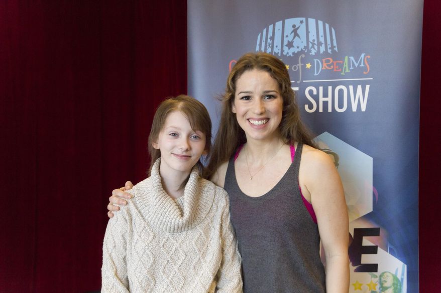In this March 17, 2016 released by Madison Square Garden, 13-year-old brain cancer survivor Hannah Pienkowski, left, poses with Chilina Kennedy, who plays Carole King on Broadway in “Beautiful: The Carole King Musical,” in New York. Kennedy helped Hannah prepare a King song for the upcoming annual Garden of Dreams talent show. (Rana Faure/MSG Photo Services via AP)