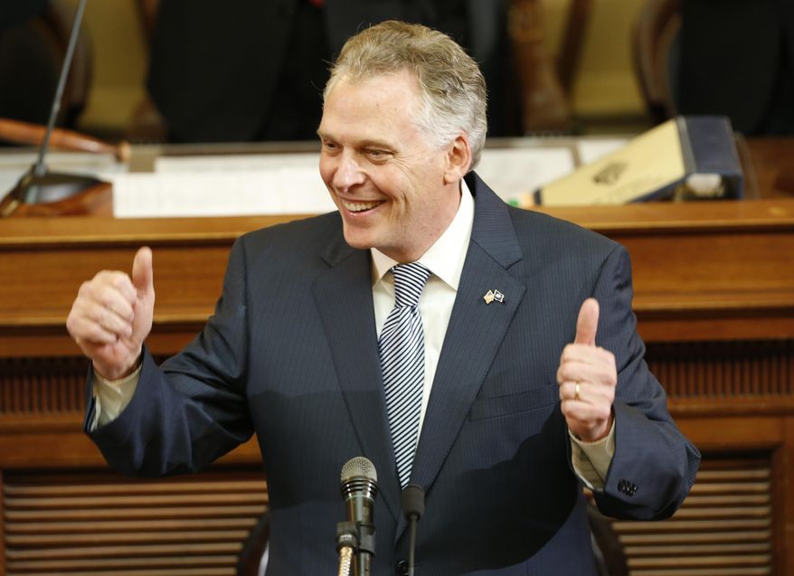 FILE - In this Jan. 13, 2016, file photo, Virginia Gov. Terry McAuliffe gestures as he delivers his State of the Commonwealth Address before a joint session of the 2016 Virginia Assembly at the Capitol in Richmond, Va. McAuliffe made ethics reform an early priority and said he's broken from past gubernatorial practice of routinely accepting gifts like private jet rides, use of multimillion-dollar vacation homes or access to private suites at Washington Redskins games. (AP Photo/Steve Helber, File)