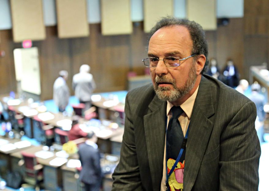 Capitol Media Services reporter Howie Fischer talks with the Arizona Republic about the Arizona House of Representatives denying reporters access to the floor pending criminal and civil background checks, in Phoenix on Thursday, April 7, 2016. (AP Photo/Ryan VanVelzer)