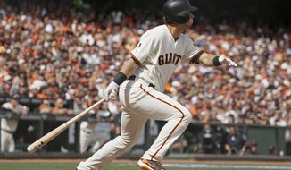 San Francisco Giants&#39; Joe Panik hits an RBI-triple off Los Angeles Dodgers starting pitcher Alex Wood in the fifth inning of their baseball game Thursday, April 7, 2016, in San Francisco. (AP Photo/Eric Risberg)