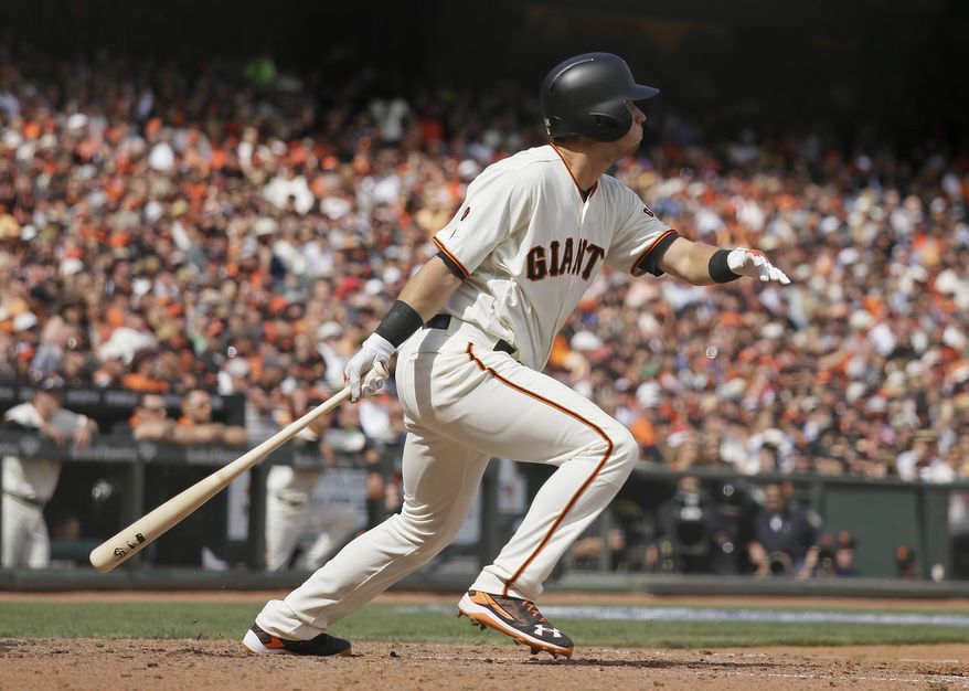 San Francisco Giants' Joe Panik hits an RBI-triple off Los Angeles Dodgers starting pitcher Alex Wood in the fifth inning of their baseball game Thursday, April 7, 2016, in San Francisco. (AP Photo/Eric Risberg)