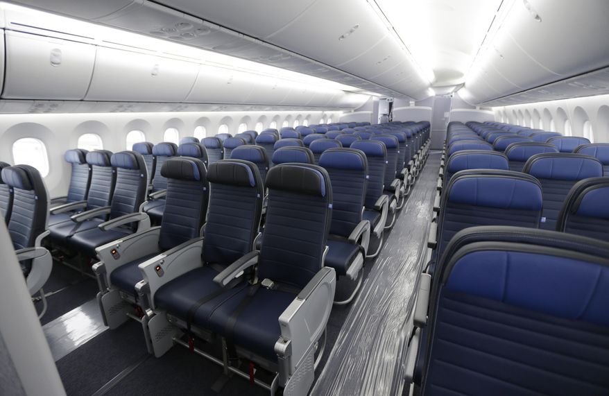 FILE - In this Jan. 26, 2016, file photo, economy class seating is shown on a new United Airlines Boeing 787-9 undergoing final configuration and maintenance work at Seattle-Tacoma International Airport in Seattle. The Senate refused April 7 to come to the aid of airline passengers squeezed by the ever-shrinking size of their seats. An amendment by Sen. Chuck Schumer, D-N.Y., would have blocked airlines from further reducing the "size, width, padding, and pitch" of seats, passengers' legroom and the width of aisles. (AP Photo/Ted S. Warren, File)