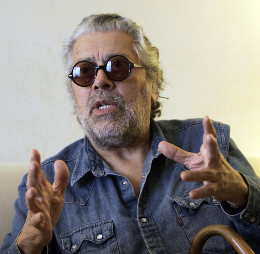 FILE - In this Aug. 7, 2008 file photo Argentine folk singer Facundo Cabral speaks during an interview with The Associated Press in Miami. A court in Guatemala has found 5 men guilty on Thursday, April 7, 2016, of the 2011 shooting death of Cabral. (AP Photo/Alan Diaz, File)