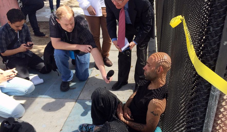 John Visor is interviewed by members of the media in San Francisco, Thursday, April 7. 2016. Visor says he witnessed the fatal shooting by San Francisco Police of an unidentified Latino man carrying a knife. He explained that he lived in the same homeless tent encampment and considered him a friend. (AP Photo/Paul Elias)