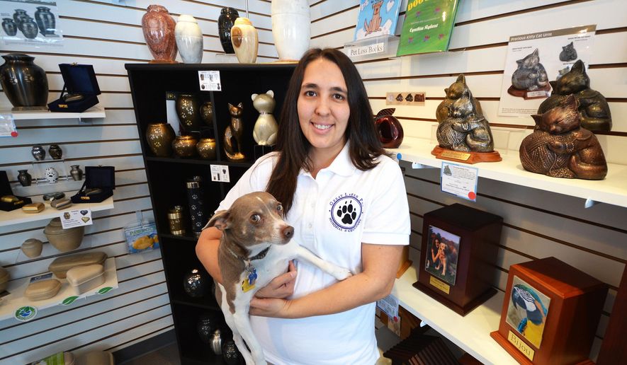 ADVANCED FOR RELEASE SUNDAY, APRIL 10, 2016 Kerri Collier owns Great Lakes Pet Memorial, a Traverse City, Mich. company that offers pet cremation services and memorial products. (Dan Nielsen/Traverse City Record-Eagle via AP)
