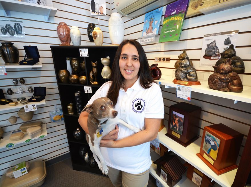 ADVANCED FOR RELEASE SUNDAY, APRIL 10, 2016 Kerri Collier owns Great Lakes Pet Memorial, a Traverse City, Mich. company that offers pet cremation services and memorial products. (Dan Nielsen/Traverse City Record-Eagle via AP)
