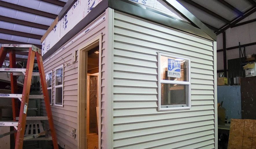 In this Friday, April 1, 2016 photo, a tiny house being built to house homeless veterans is shown in Racine, Wis. (Gregory Shaver/The Journal Times via AP) MANDATORY CREDIT