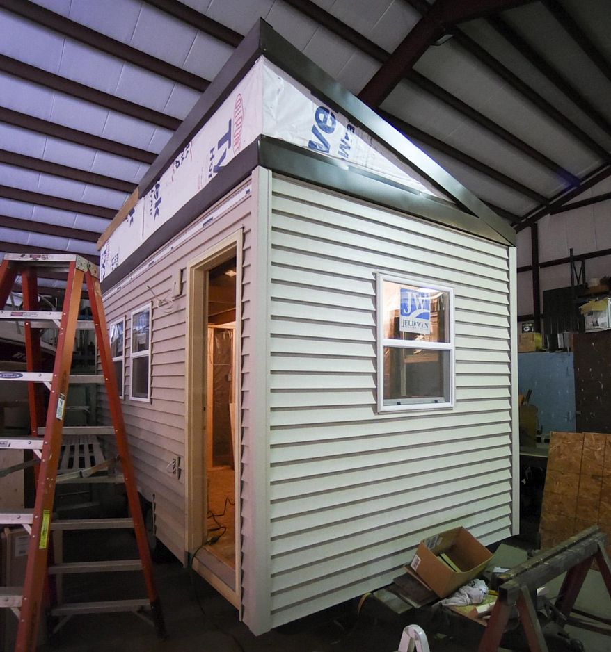 In this Friday, April 1, 2016 photo, a tiny house being built to house homeless veterans is shown in Racine, Wis. (Gregory Shaver/The Journal Times via AP) MANDATORY CREDIT