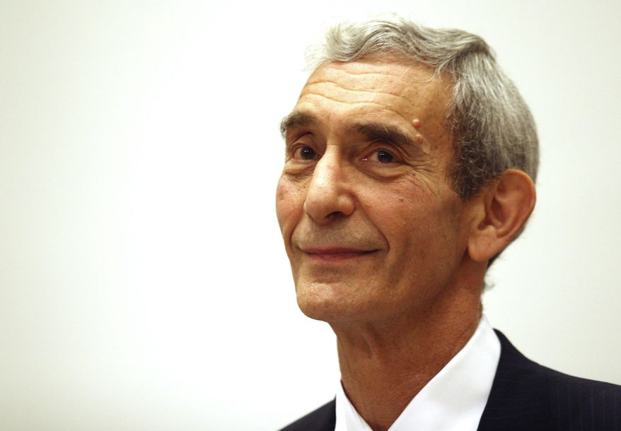 FILE- In this July 18, 2007 file photo, Chief Medical Examiner Dr. Charles Hirsch looks on during a news conference celebrating the opening of the new Forensic Biology Laboratory at the Office of the Chief Medical Examiner in New York. Hirsch, the doctor who oversaw the New York City medical examiner's office for more than two decades and whose staff helped identify thousands of 9/11 victims has died at the age of 79. New York City Mayor Bill de Blasio announced Hirsch's death on Friday, April 8, 2016. (AP Photo/Tina Fineberg, File)