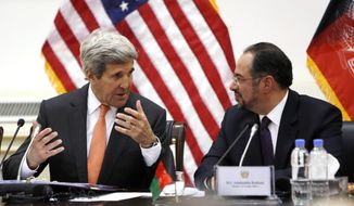 U.S. Secretary of State John Kerry, left, and Afghanistan&#39;s Foreign Minister Salahuddin Rabbani talk at the start of their bilateral commission talks at Char Chinar Palace in Kabul, Afghanistan, Saturday, April 9, 2016. (Jonathan Ernst/Pool via AP)