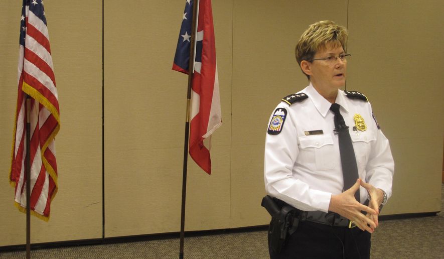 Columbus Police Chief Kim Jacobs discusses a shooting that left a SWAT officer in critical condition as officers attempted to arrest a suspect on an arson charge, on Sunday, April 10, 2016, in Columbus, Ohio. Police said the officer was in a SWAT vehicle approaching the suspect’s apartment early Saturday morning when shots were fired, hitting the officer. (AP Photo/Andrew Welsh-Huggins)
