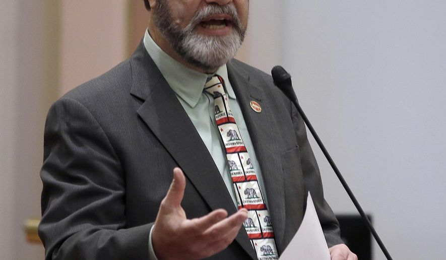 FILE - In this March 10, 2016 file photo, California state Sen. John Moorlach, R-Costa Mesa, speaks on the floor of the Senate at the Capitol in Sacramento. Moorlach, who has been a vocal critic of the state's nearly $64 billion unfunded retirement debt, is one of 17 state legislators who collect government pension checks on top of their monthly salaries. As a former Orange County treasurer, he receives an $83,827 county retirement check while making $100,113 a year as a senator.(AP Photo/Rich Pedroncelli, Fie)