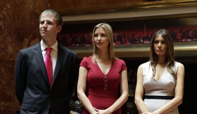 Donald Trump&#x27;s children Eric Trump, and Ivanka Trump, center, and Donald Trump&#x27;s wife Melania Trump, attend a news conference, in New York, Thursday, May 1, 2014. (AP Photo/Richard Drew)