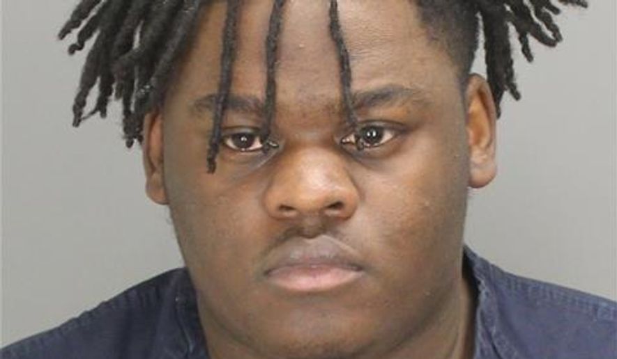 Anthony Lamar Henderson is seen in an undated photo provided by the Oakland County Sheriff’s Office. The Oakland County sheriff's department says Anthony Lamar Henderson is charged with uttering and publishing counterfeit bank bills, a felony, and larceny by false pretense, a misdemeanor. A judge set bond at $50,000 and he was being held in the Oakland County Jail. (Oakland County Sheriff’s Office via AP)