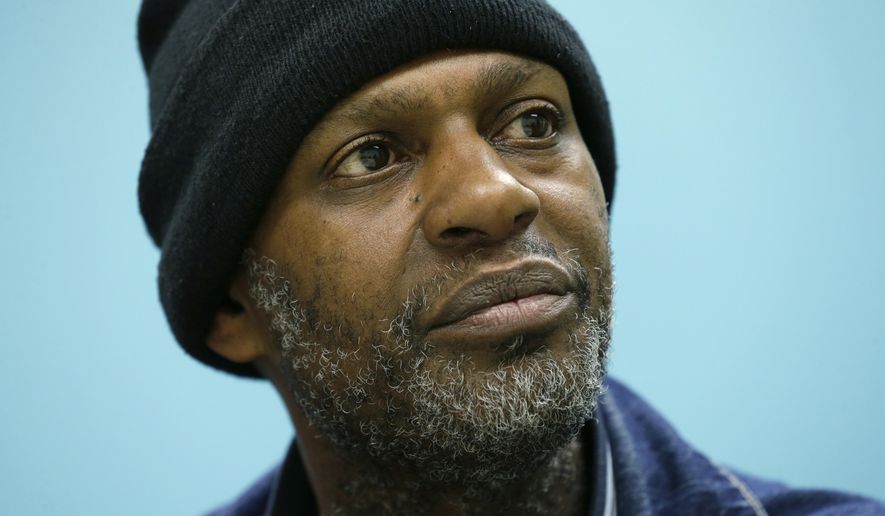In this March 25, 2016 photo, Jerald Brooks, one of the original participants in a Seattle program called Law Enforcement Assisted Diversion, or LEAD, listens to a question from his caseworker during a meeting in Seattle. Funding from the expansion of Medicaid brought on by President Barack Obama's health care law in some states has made repeat drug offenders such as Brooks eligible for coverage, which could be a new tool for shifting addicts out of the criminal-justice system as an alternative to the drug war. (AP Photo/Ted S. Warren)