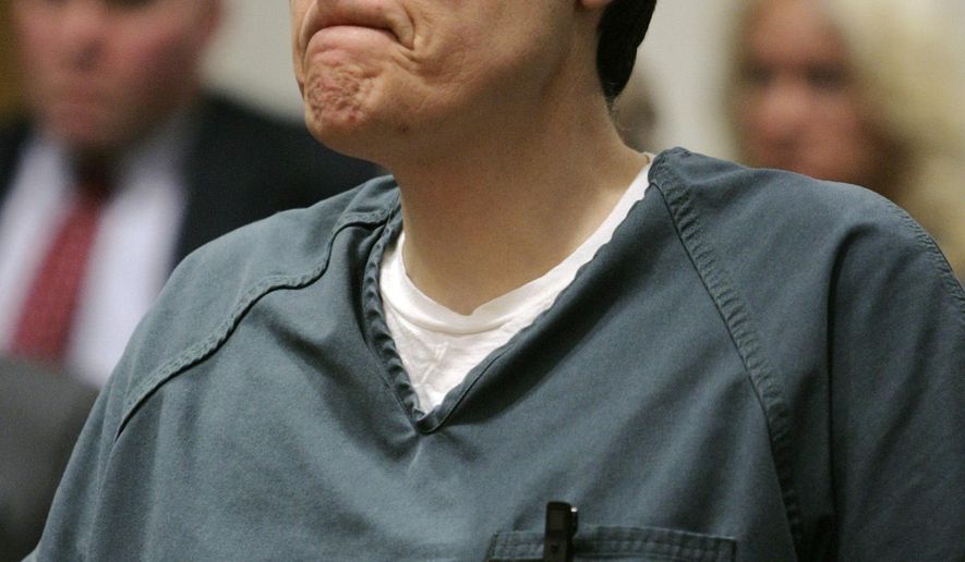 FILE - This Friday March 18, 2005 file photo shows former Springboro Police Lt. Thomas "Jim" Barton listening as he is given the maximum sentence in the shooting death of his wife in Warren County Court in Lebanon, Ohio. The attorney for Barton, a former police official wants a judge to set bail for him in southwest Ohio after a federal court threw out his 2005 conviction on charges from his wife's slaying in a botched burglary. (AP Photo/Al Behrman, File)