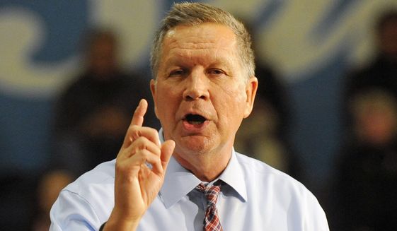 Republican presidential candidate, Ohio Gov. John Kasich argues he's running a positive campaign even as political action committee allies insult opponents. (Associated Press)