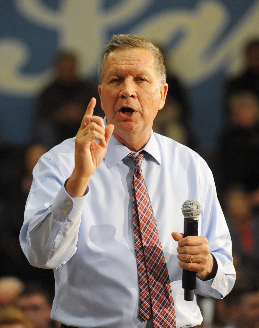 Republican presidential candidate, Ohio Gov. John Kasich argues he's running a positive campaign even as political action committee allies insult opponents. (Associated Press)