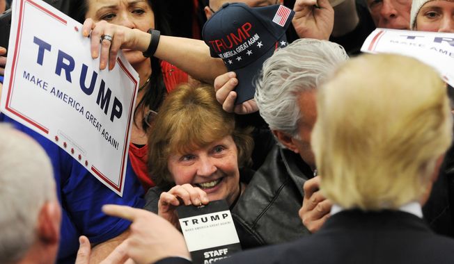 Supporters for Presidential candidate Donald J. Trump wait for autographs following a rally at Griffiss International Airport, Tuesday, April 12, 2016 in Rome, N.Y. (Mark DiOrio/Observer-Dispatch via AP)