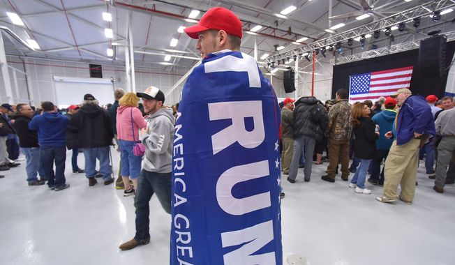 Chris Landcastle of Westmoreland, N.Y., waits for a rally to begin for Republican presidential candidate Donald Trump at Griffiss International Airport, Apr. 12, 2016, in Rome, N.Y. (Mark DiOrio/Observer-Dispatch via AP)